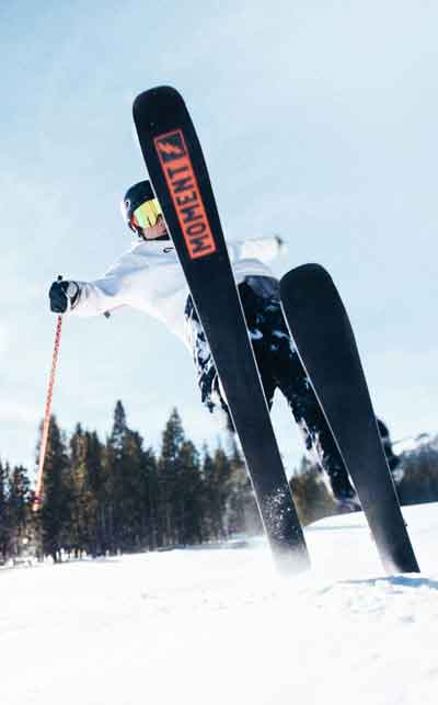 Skier mid-air showing Moment Frankenski bases