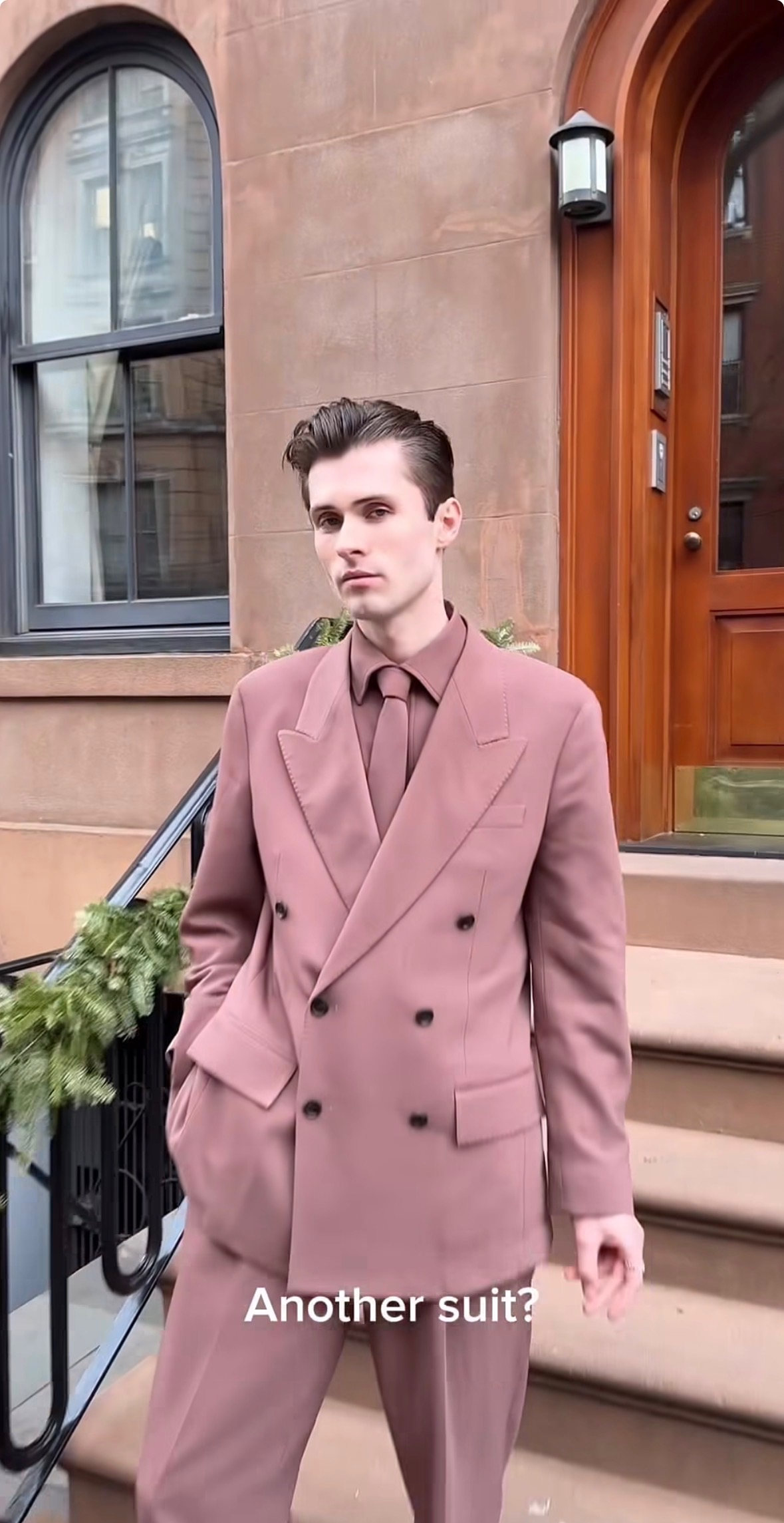 content creator Dylan Kelly wearing a pink suit