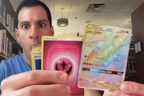 Man pulling the super rare pokemon card