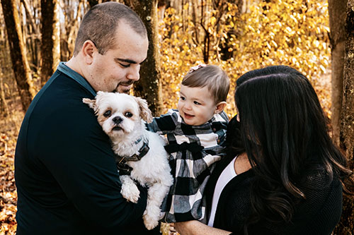 Family with dog in fall