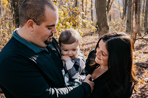 Parents with baby in woods