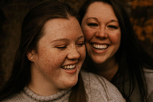 Two sisters laughing