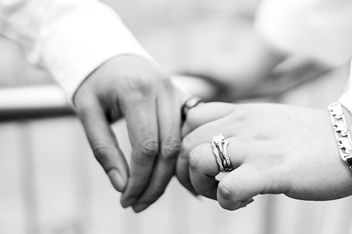 Two hands with rings