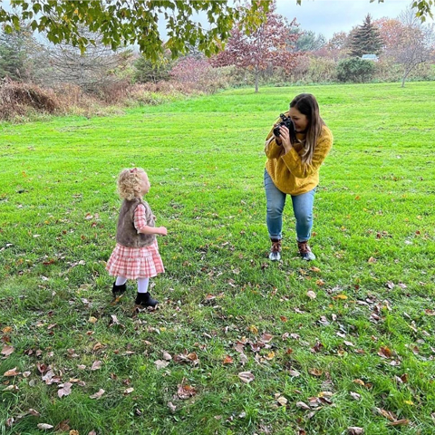 Jena Pursell with child client taking their picture