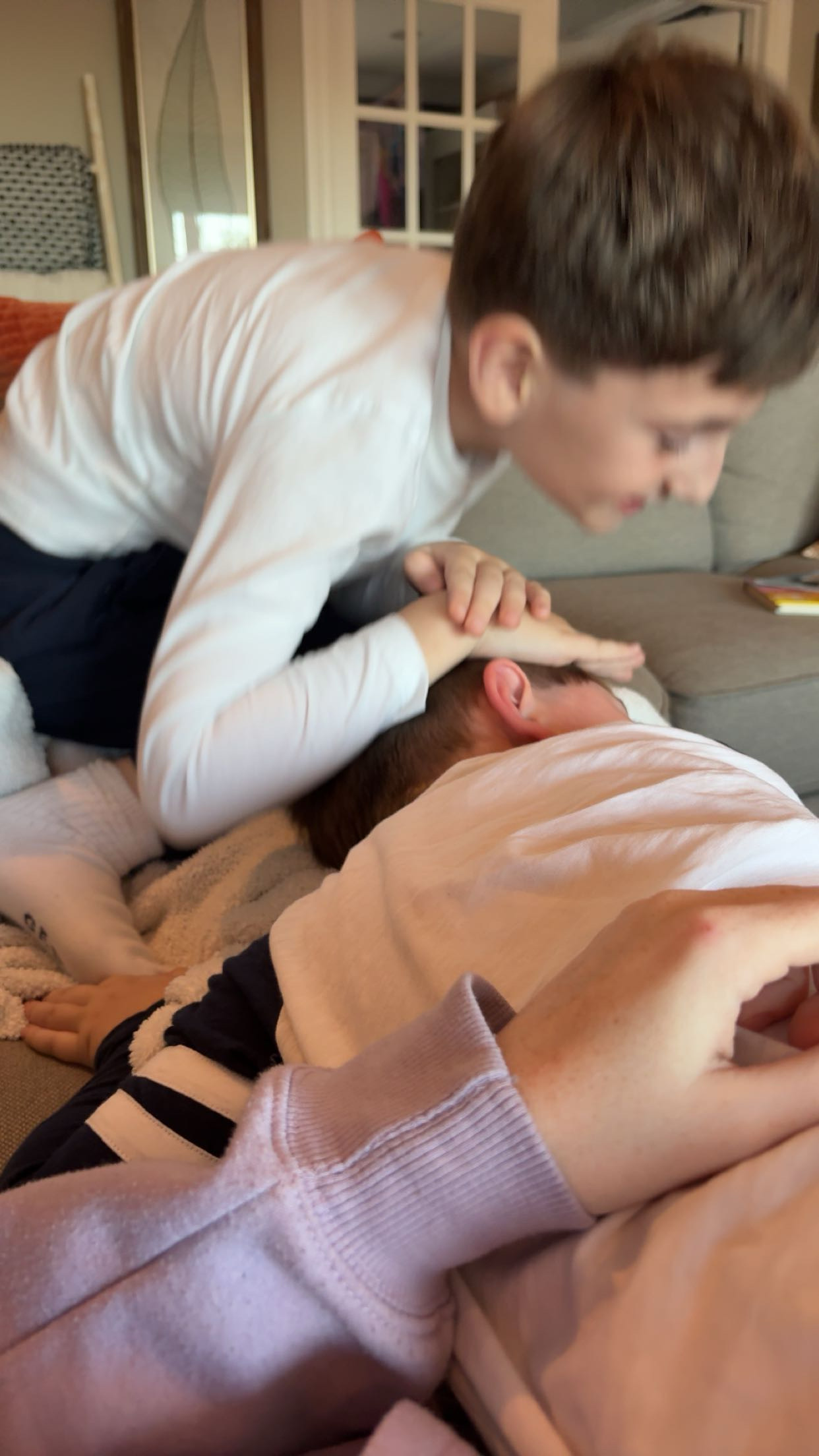 boys playing on the couch