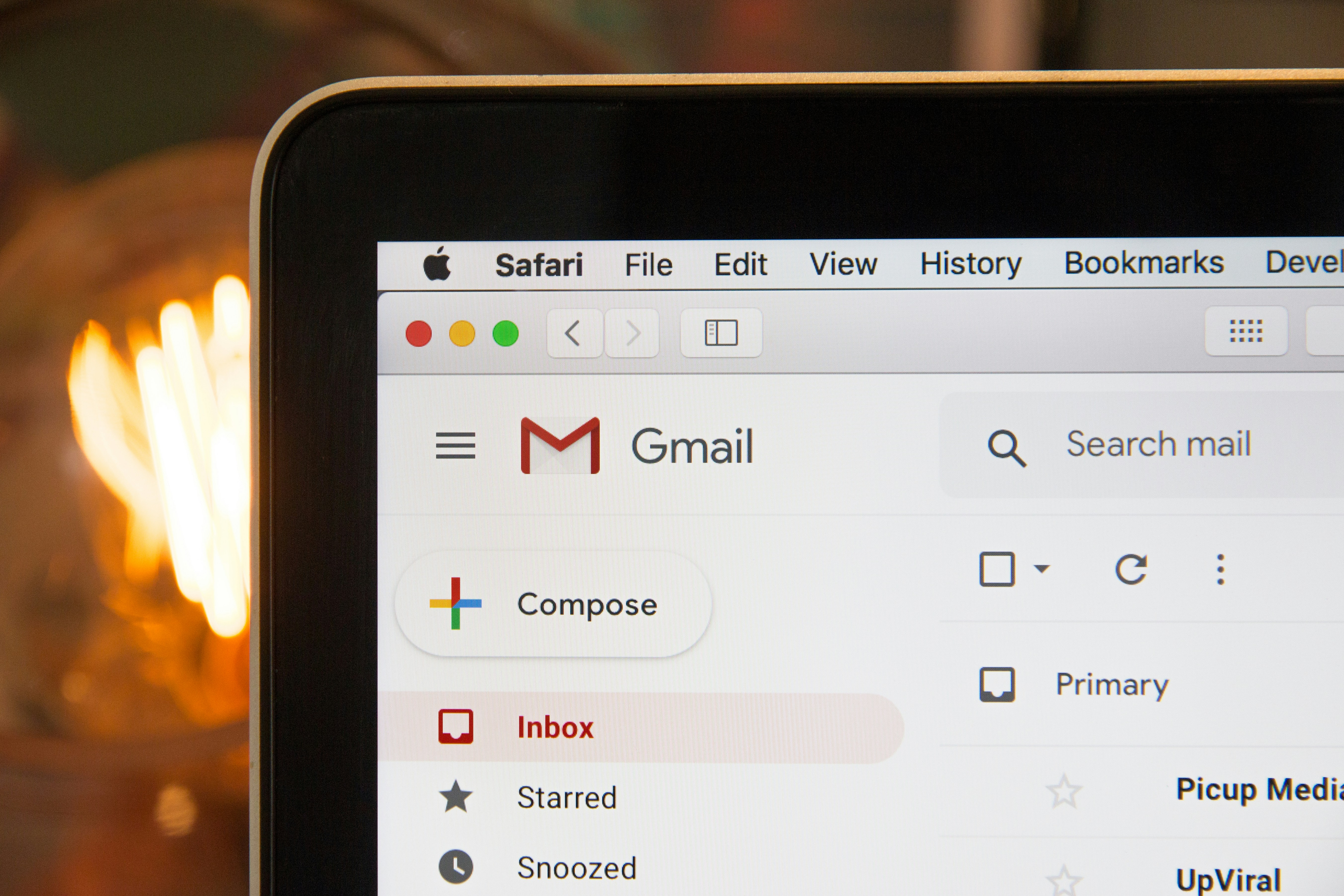 Image that shows the top left of a laptop with the gmail logo showing