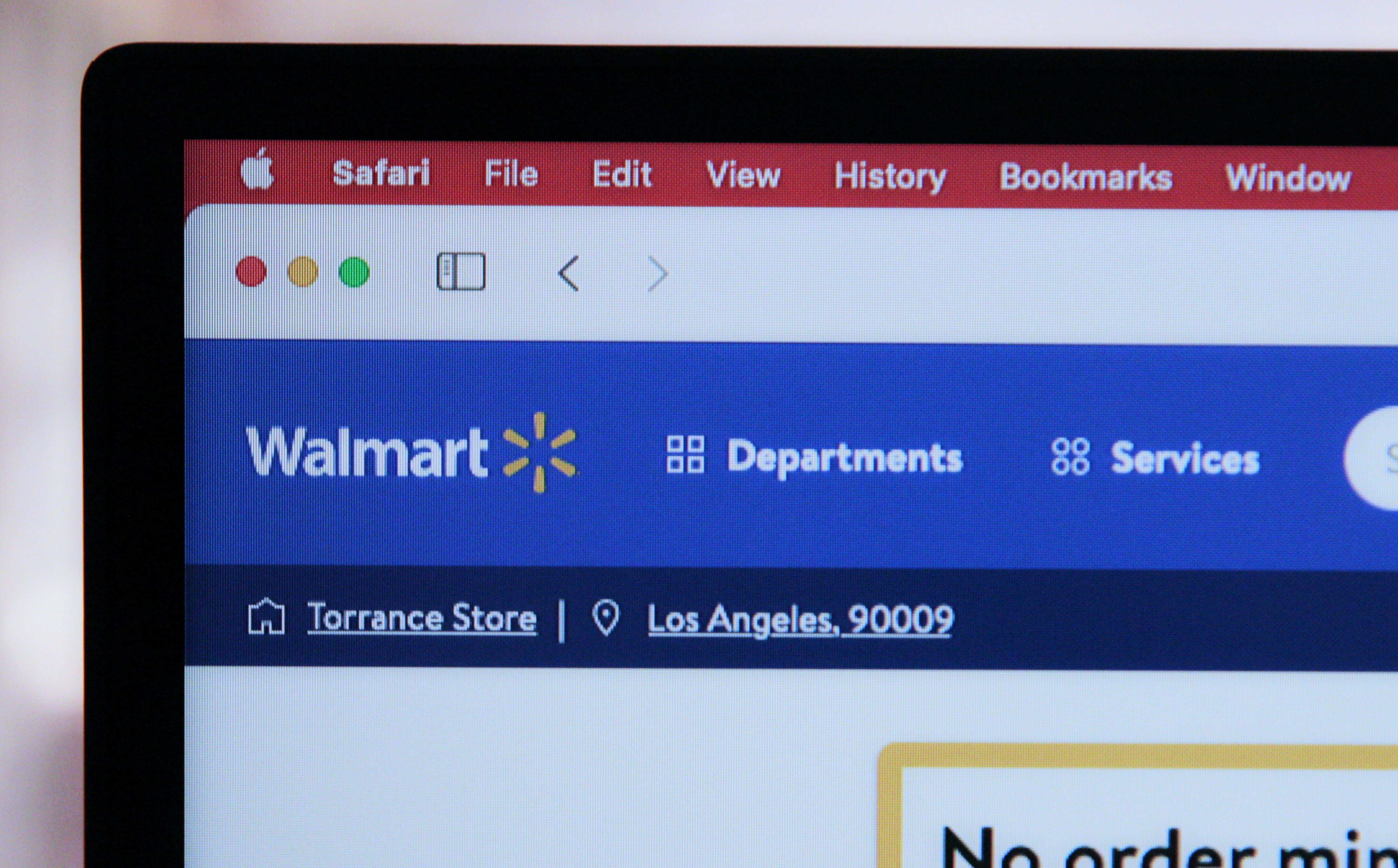 Image of the top left of a computer showing the Walmart logo