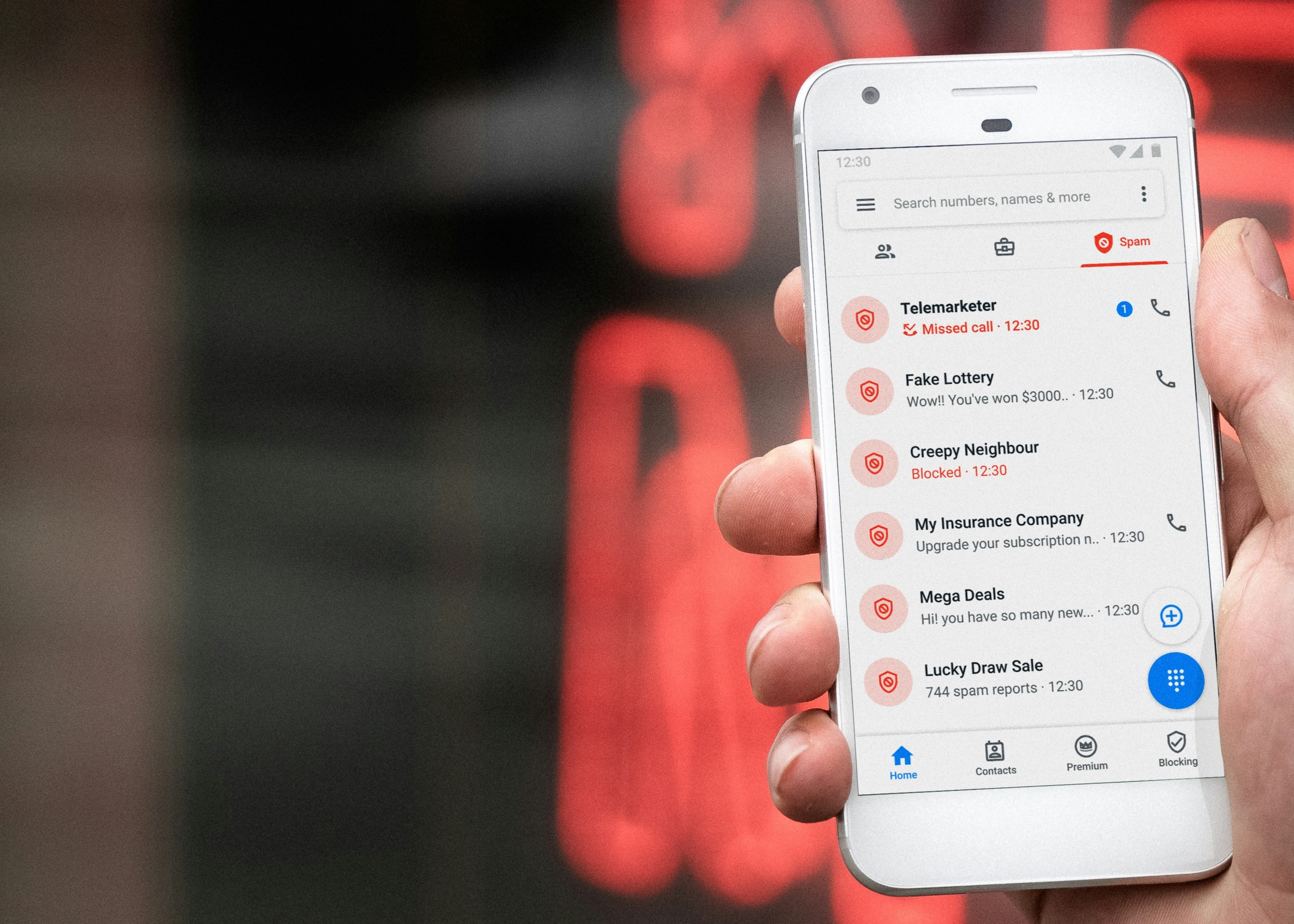 Photo of a phone with fake callers on screen